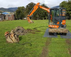 Excavator Using ProtectaMats Ground Protection Mats Showing Ruts Made