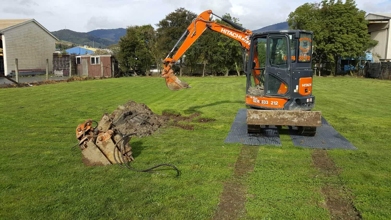 Excavator Using ProtectaMats Ground Protection Mats Showing Ruts Made